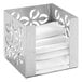 A stainless steel Rosseto napkin holder with white folded napkins in it.