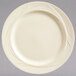 A Libbey round cream white medium rim china plate with swirls on it.