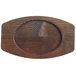 A wooden oval Libbey cedar plank underliner with a carved surface.