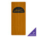 A Menu Solutions country oak wood menu board on a table with a wooden door with a black and orange logo.