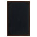 A brown wooden menu board with picture corners.