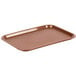 A brown Choice plastic fast food tray on a school kitchen counter.