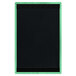 A black board with a green border and top and bottom strips of wood with a white menu sheet inside.