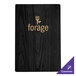 A black wood Menu Solutions menu board with gold picture corners.