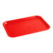 A rectangular red plastic fast food tray with raised edges.
