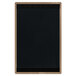 A black rectangular wood menu board with a tan edge.