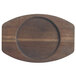 A wooden surface with an oval shaped Libbey cedar plank underliner.