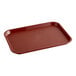 A rectangular burgundy plastic fast food tray with raised edges.
