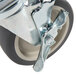 A close-up of a 5" metal wheel with a metal brake screw.
