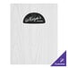 A white wood Menu Solutions board with black and white logo strips on a counter.
