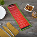 A customizable wood menu clip board on a table with a fork and knife.