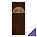 A walnut wood menu board with picture corners on a table with a menu in it.