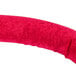A red stanchion rope with brass ends on a white background.