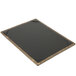 A weathered walnut wood menu board with gold picture corners on a table.