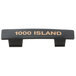A black rectangular Tablecraft dispenser tag with orange text reading "Thousand Island"