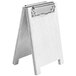 A white wooden table tent with a metal clip.
