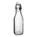 An Acopa clear glass bottle with a wire bail swing top lid.