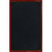 A brown wooden menu board with black picture corners.