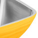 A square yellow stainless steel Vollrath serving bowl.