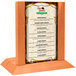 A Menu Solutions wooden stand with a menu on it.