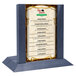 A wooden Menu Solutions menu holder with a denim insert slot on a table.