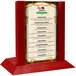A wooden Menu Solutions menu holder on a table.