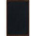 A brown wooden menu board with picture corners.