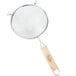A Tablecraft metal strainer with a wooden handle.