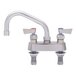 A silver Fisher deck-mounted faucet with two lever handles and a 12" swing spout.