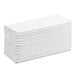 A stack of Lavex white multifold paper towels.