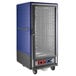 A blue and grey Metro C5 heated holding and proofing cabinet with wheels.