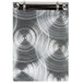 An Alumitique aluminum menu board with swirl rings on a metal surface.