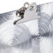 A Menu Solutions Alumitique aluminum table tent with a clip on it.