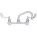 Fisher 57509 Wall Mounted Stainless Steel Faucet with 8 inch Centers, 16 inch Swing Nozzle, 2.2 GPM Aerator, and Wrist Handles