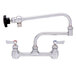 A Fisher stainless steel pot filler faucet with double-jointed control spout and lever handles.