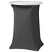 A black Snap Drape spandex tray stand cover on a white table.