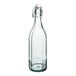 An Arcoroc clear glass swing top bottle with a green cap.