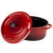 A red oval Dutch oven with a lid.