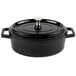 A black enamel coated cast aluminum oval pot with a lid.