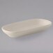 A white rectangular Tuxton eggshell china relish tray.