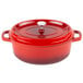 A red oval Dutch oven with a lid.