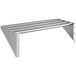 A Regency stainless steel tubular wall mounted shelf with four metal bars.