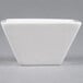 An American Metalcraft white square porcelain sauce cup.