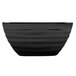 A black Vollrath square serving bowl with a curved edge.