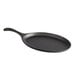 A Valor pre-seasoned cast iron fajita skillet with a handle.