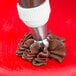 A close up of a brown pastry made with an Ateco Russian ball tip.