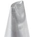 A silver cone shaped object with a curved tip.