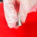 A hand holding an Ateco open star piping tip.