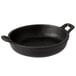 A black cast iron round casserole dish with handles.