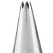 An Ateco silver metal open star piping tip with a small hole in it.